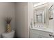Stylish powder room featuring a modern vanity and elegant mirror at 2751 Pilgrim Mill Rd, Cumming, GA 30041