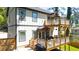 Charming home with multi-level back decks, perfect for entertaining and enjoying the outdoors at 308 Reed St, Scottdale, GA 30079