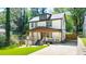 Beautiful two-story home featuring a welcoming covered front porch and a private driveway at 308 Reed St, Scottdale, GA 30079