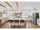 Bright and modern kitchen showcasing an island, stainless steel appliances, and decorative pendant lights at 308 Reed St, Scottdale, GA 30079