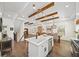 Stylish kitchen with an island, stainless steel appliances, and an open layout connecting to the dining area at 308 Reed St, Scottdale, GA 30079