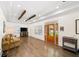 Bright and airy living room featuring hardwood floors, tray ceilings, and stylish furniture at 308 Reed St, Scottdale, GA 30079