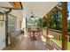 Relaxing covered porch with outdoor seating and a view of the landscaped backyard at 308 Reed St, Scottdale, GA 30079