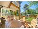 Inviting covered porch featuring outdoor seating and beautiful views of the surrounding greenery at 308 Reed St, Scottdale, GA 30079