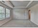 Bright bedroom with a tray ceiling, carpeted floors, and large windows for natural light at 3587 Hidden Valley Cir, Lawrenceville, GA 30044