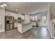Open kitchen with stainless steel appliances, center island, and access to the outdoors at 3587 Hidden Valley Cir, Lawrenceville, GA 30044