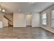 Open-concept living area with hardwood floors and natural light coming in from the windows at 3587 Hidden Valley Cir, Lawrenceville, GA 30044