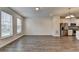 This is a bright living room with hardwood floors and large windows that bring in natural light at 3587 Hidden Valley Cir, Lawrenceville, GA 30044