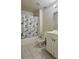 Bathroom featuring a vanity, toilet, and shower with neutral finishes at 5783 Poppy Tree Ln, Tucker, GA 30084