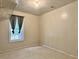 Simple bedroom with one window and light tile flooring at 5783 Poppy Tree Ln, Tucker, GA 30084