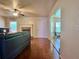 Living room features a fireplace, hardwood floors, and a view into the breakfast nook for entertaining at 5783 Poppy Tree Ln, Tucker, GA 30084