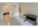 Tiled floor room featuring a desk and view into a room suitable for storage at 5783 Poppy Tree Ln, Tucker, GA 30084