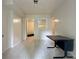 Tiled room space featuring a desk and view into an adjacent storage space at 5783 Poppy Tree Ln, Tucker, GA 30084
