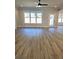 Bright and spacious living room with luxury vinyl flooring and plenty of natural light at 1695 Crumbley Rd, Mcdonough, GA 30252