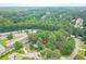 Aerial view of home nestled among trees, with nearby neighborhood at 2825 Shea Sw Way, Marietta, GA 30060