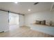 Finished basement with open layout, featuring a sliding barn door and built-in bench seating at 2825 Shea Sw Way, Marietta, GA 30060