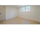 The basement room has wood floors, a single window, and a door for entry/exit at 2825 Shea Sw Way, Marietta, GA 30060