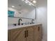 Elegant bathroom featuring a double sink vanity with a marble countertop and contemporary fixtures at 2825 Shea Sw Way, Marietta, GA 30060