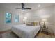 This bedroom features a modern ceiling fan, stylish lamps, and decorative wall paneling for a cozy feel at 2825 Shea Sw Way, Marietta, GA 30060