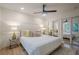 The bedroom features a modern ceiling fan, stylish lamps, and mirrored closet doors for an added touch of luxury at 2825 Shea Sw Way, Marietta, GA 30060