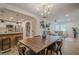 Open floor plan with bar, dining area, and living room, all featuring contemporary decor at 2825 Shea Sw Way, Marietta, GA 30060