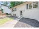 The house has a welcoming entrance with a landscaped front yard and a gray painted front door at 2825 Shea Sw Way, Marietta, GA 30060
