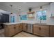 Open kitchen featuring stainless steel appliances, eat-in island, and wood cabinets at 2825 Shea Sw Way, Marietta, GA 30060