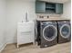 Convenient laundry room with modern washer and dryer, sink, and storage cabinets at 2825 Shea Sw Way, Marietta, GA 30060