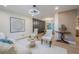 Living room featuring light colored walls, stylish seating, and a view into the adjacent dining area at 2825 Shea Sw Way, Marietta, GA 30060