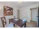 Well-lit office features a large desk, a decorative painting, and bi-fold closet at 2825 Shea Sw Way, Marietta, GA 30060