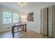 Bright office with large windows, wooden desk, and ample storage space at 2825 Shea Sw Way, Marietta, GA 30060