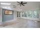 Sunroom featuring skylights, a ceiling fan, and access to the home's exterior at 2825 Shea Sw Way, Marietta, GA 30060