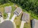 Aerial view of residential neighborhood featuring well-maintained homes, driveways, and landscaping at 340 Louise Ln, Canton, GA 30114