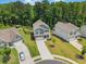 Spacious homes with pristine lawns and driveways in a lush, green neighborhood setting at 340 Louise Ln, Canton, GA 30114