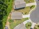 Overhead shot of homes with manicured lawns, driveways, and lush surrounding greenery at 340 Louise Ln, Canton, GA 30114