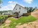 Fenced backyard with deck, grass, and trees at 340 Louise Ln, Canton, GA 30114
