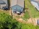 Aerial view of fenced backyard featuring a deck, grassy area, and privacy trees at 340 Louise Ln, Canton, GA 30114
