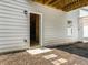 Basement access with door leading to unfinished space, offering potential for customization and extra storage at 340 Louise Ln, Canton, GA 30114