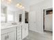 A stylish bathroom featuring dual sinks with granite countertops and modern cabinetry at 340 Louise Ln, Canton, GA 30114