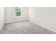 Empty bedroom with gray carpet and a window at 340 Louise Ln, Canton, GA 30114