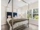 Bright bedroom featuring a four poster bed, and natural lighting from surrounding windows at 340 Louise Ln, Canton, GA 30114
