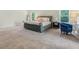 Bright bedroom with a tufted bed, natural light, and neutral walls at 340 Louise Ln, Canton, GA 30114