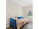 Minimalist bedroom with blue daybed and natural light at 340 Louise Ln, Canton, GA 30114