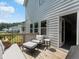 Outdoor deck area with seating and view to backyard at 340 Louise Ln, Canton, GA 30114