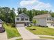 Charming home with stone accents, a well-kept lawn, and a cozy front porch at 340 Louise Ln, Canton, GA 30114