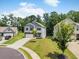 Well-maintained two-story home featuring a manicured lawn, a long driveway, and mature trees at 340 Louise Ln, Canton, GA 30114