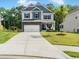 Charming two-story home with stone accents, attached garage, manicured lawn, and welcoming front porch at 340 Louise Ln, Canton, GA 30114