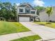 Charming two-story home with stone accents, attached garage, manicured lawn, and welcoming front porch at 340 Louise Ln, Canton, GA 30114