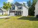 Charming two-story home with stone accents, attached garage, manicured lawn, and welcoming front porch at 340 Louise Ln, Canton, GA 30114