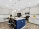 Modern kitchen with center island, pendant lighting, stainless steel appliances, and barstool seating at 340 Louise Ln, Canton, GA 30114